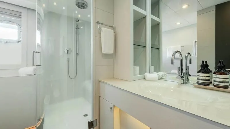  Yacht Photos Pics Luxurious bathroom on Ortona Navi ZIA yacht, featuring modern shower and sleek vanity, 2008 model.