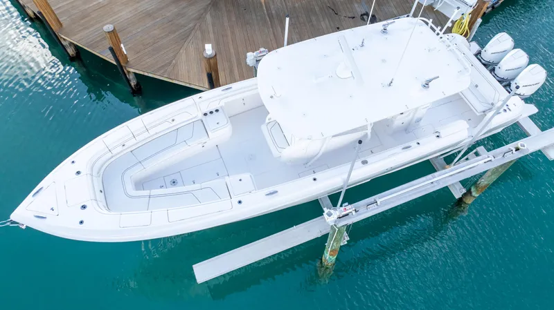  Yacht Photos Pics 2019 Intrepid 400 Center Console boat docked in turquoise water, aerial view.