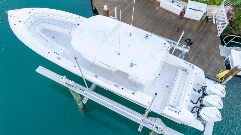  Yacht Photos Pics 2019 Intrepid 400 Center Console boat docked, aerial view, turquoise water background.