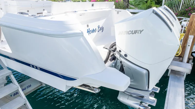  Yacht Photos Pics 2019 Intrepid 400 Center Console boat with Mercury engines docked in clear water.