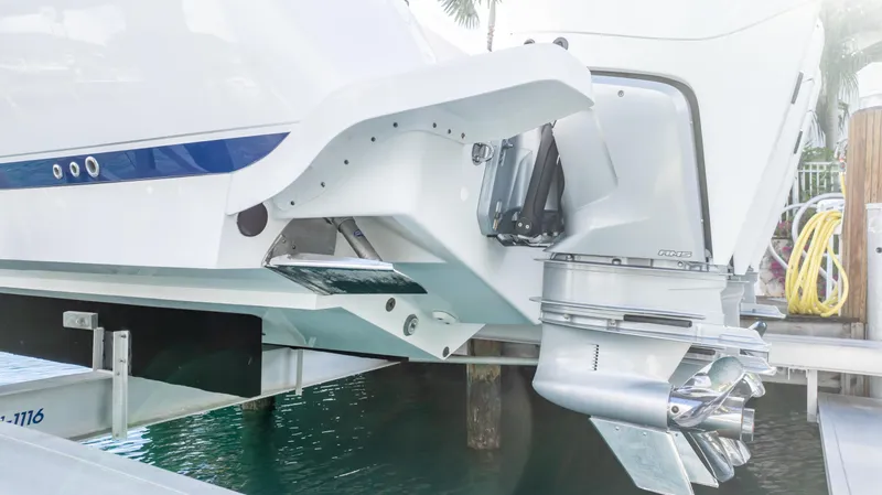  Yacht Photos Pics 2019 Intrepid 400 Center Console boat with powerful outboard motor, docked near water.