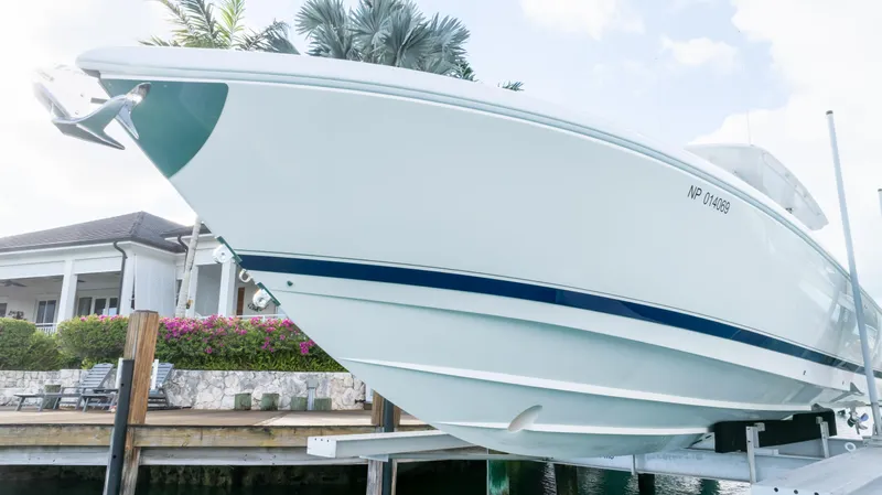  Yacht Photos Pics 2019 Intrepid 400 Center Console boat docked near waterfront home.