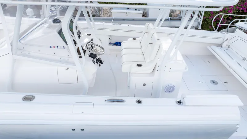 Yacht Photos Pics 2019 Intrepid 400 Center Console boat interior with white seating and steering console.
