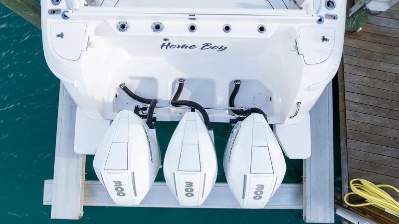 Yacht Photos Pics 2019 Intrepid 400 Center Console with triple outboard engines docked at marina.