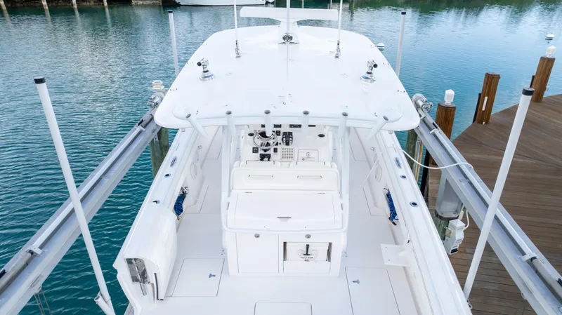  Yacht Photos Pics 2019 Intrepid 400 Center Console boat docked, showcasing spacious deck and sleek design.