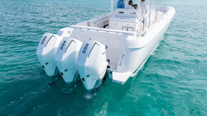  Yacht Photos Pics 2019 Intrepid 400 Center Console boat with triple outboard engines on clear water.