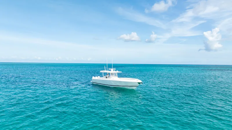  Yacht Photos Pics 2019 Intrepid 400 Center Console boat on clear blue ocean waters.