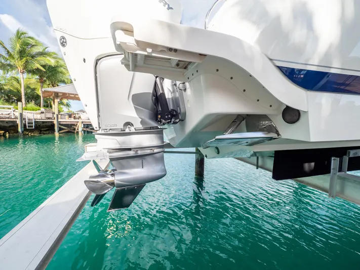  Yacht Photos Pics 2019 Intrepid 400 Center Console boat with outboard motor, docked in tropical waters.