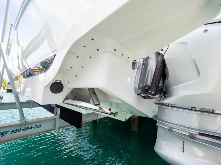  Yacht Photos Pics 2019 Intrepid 400 Center Console boat stern view with outboard motor and turquoise water.