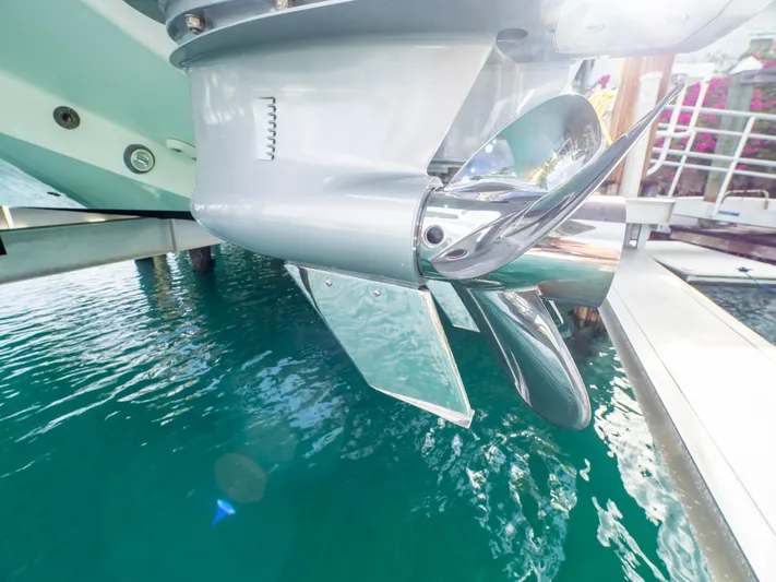  Yacht Photos Pics Close-up of a 2019 Intrepid 400 Center Console boat propeller over clear water.