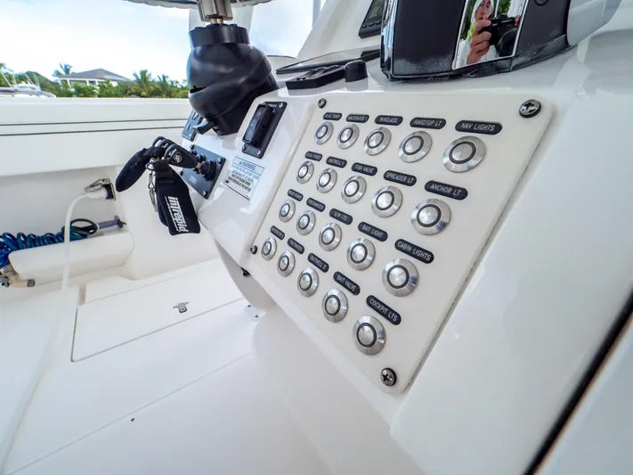  Yacht Photos Pics Control panel of a 2019 Intrepid 400 Center Console boat with labeled buttons.
