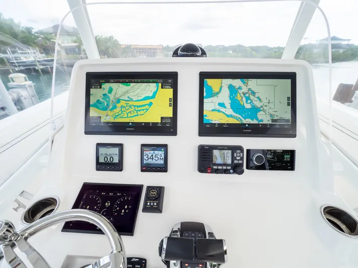  Yacht Photos Pics 2019 Intrepid 400 Center Console helm with advanced navigation displays and controls.