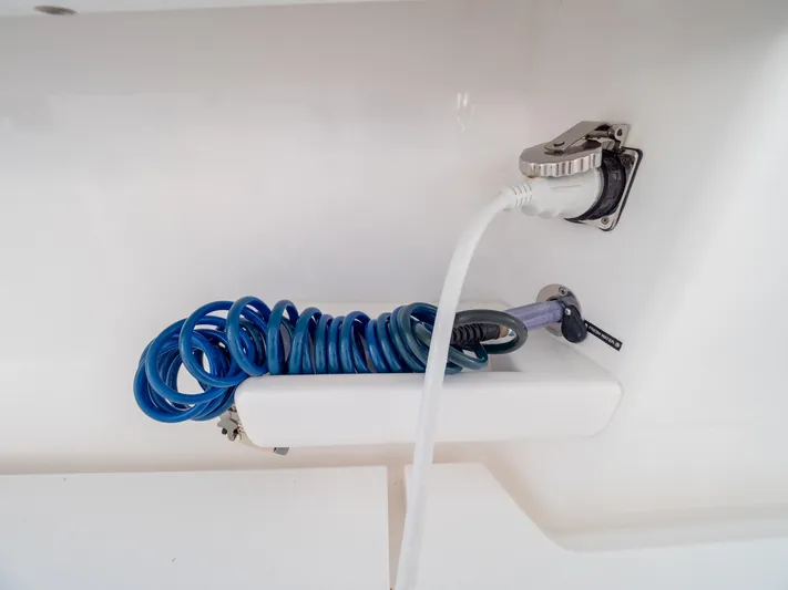  Yacht Photos Pics Coiled blue hose on 2019 Intrepid 400 Center Console boat deck.