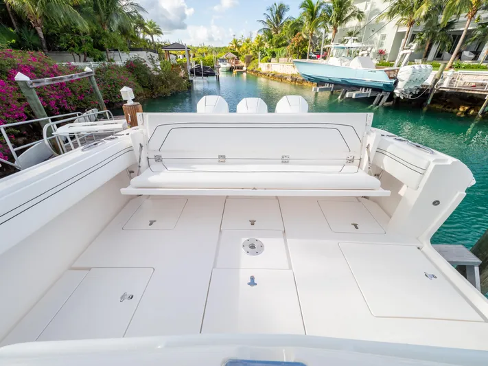  Yacht Photos Pics 2019 Intrepid 400 Center Console boat docked in a scenic canal setting.