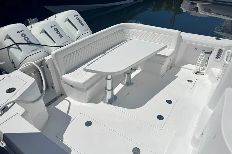  Yacht Photos Pics Luxury seating area on 2026 Intrepid 50 Evolution boat with triple Mercury engines.