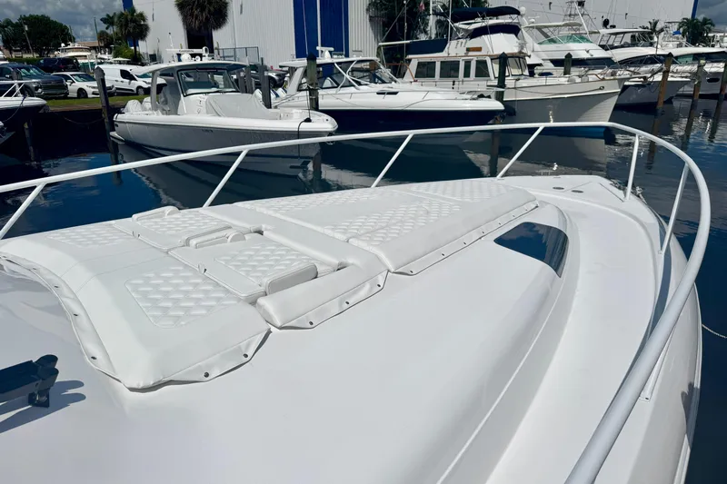  Yacht Photos Pics 2026 Intrepid 50 Evolution yacht docked, showcasing sleek design and spacious deck.