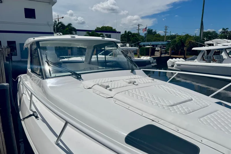  Yacht Photos Pics 2026 Intrepid 50 Evolution yacht docked at marina under clear sky.