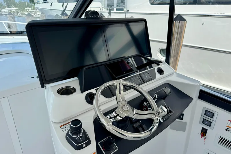  Yacht Photos Pics Helm of 2026 Intrepid 50 Evolution yacht with modern controls and navigation screens.