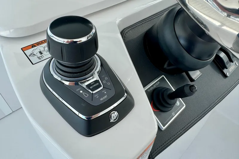  Yacht Photos Pics Control panel of 2026 Intrepid 50 Evolution boat with joystick and thruster controls.