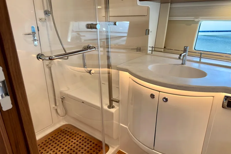  Yacht Photos Pics Luxurious bathroom in 2026 Intrepid 50 Evolution yacht with modern fixtures and elegant design.