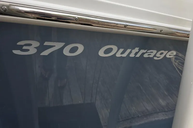  Yacht Photos Pics 2016 Boston Whaler 370 Outrage boat nameplate on hull.