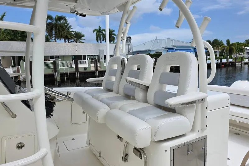  Yacht Photos Pics 2016 Boston Whaler 370 Outrage boat interior with white cushioned seating.