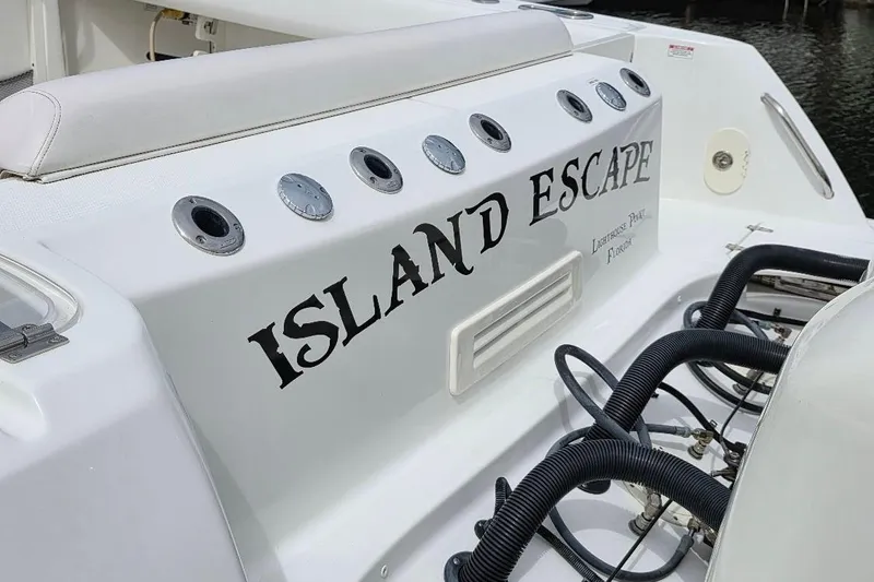  Yacht Photos Pics 2016 Boston Whaler 370 Outrage boat with "Island Escape" name on the stern.