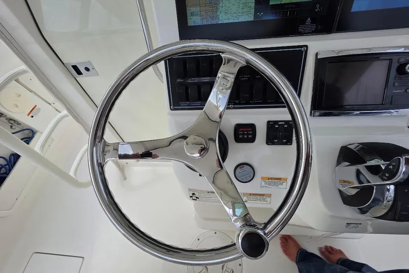  Yacht Photos Pics Steering wheel and controls of a 2016 Boston Whaler 370 Outrage boat.
