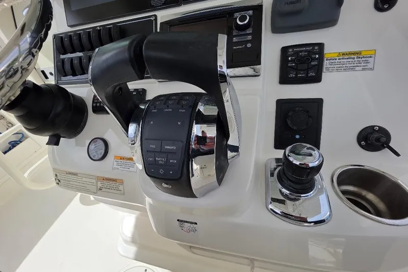  Yacht Photos Pics Control panel of a 2016 Boston Whaler 370 Outrage boat with throttle and switches.