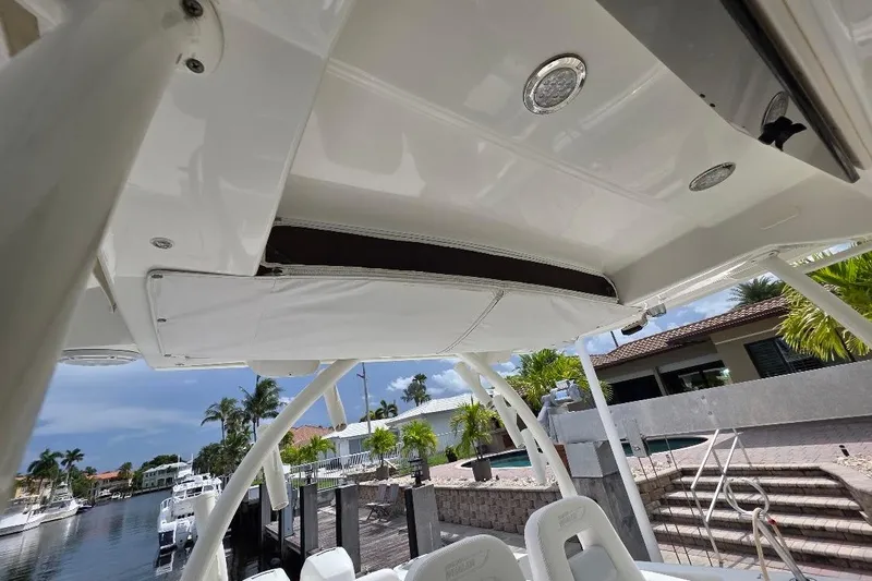  Yacht Photos Pics 2016 Boston Whaler 370 Outrage boat interior, featuring sleek design and waterfront view.