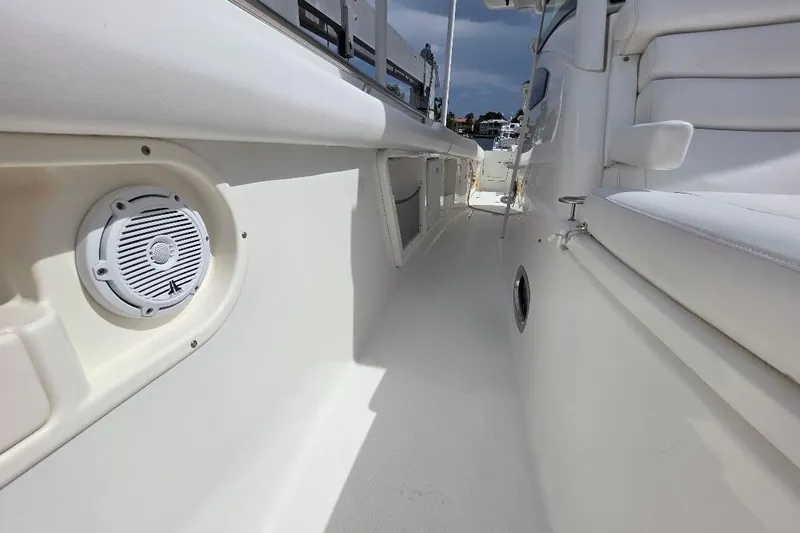  Yacht Photos Pics 2016 Boston Whaler 370 Outrage interior, featuring white seating and marine speaker.