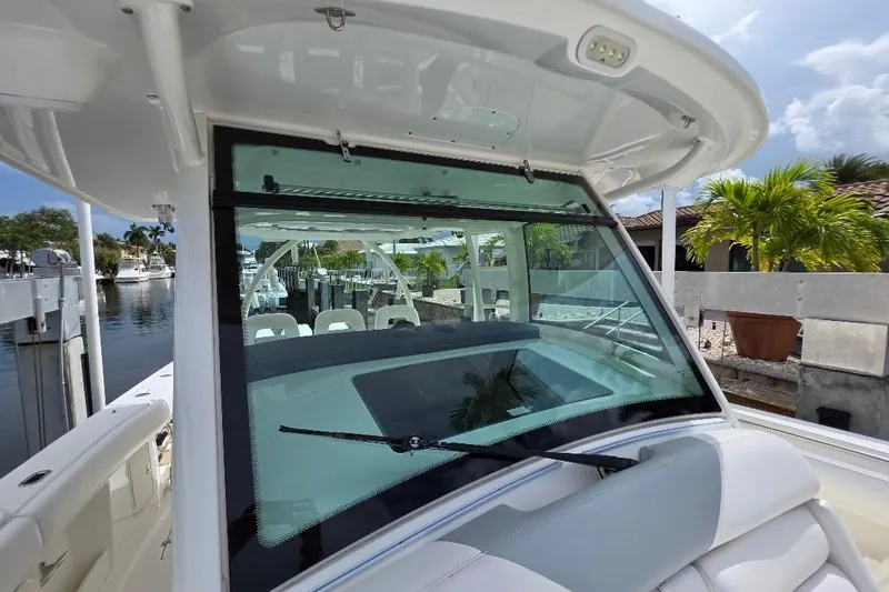  Yacht Photos Pics 2016 Boston Whaler 370 Outrage boat with sleek windshield and luxurious seating.
