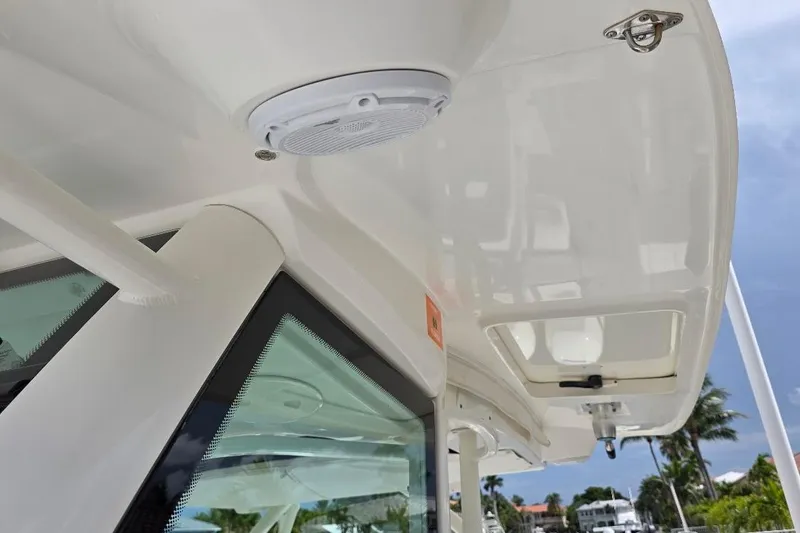 Yacht Photos Pics 2016 Boston Whaler 370 Outrage boat roof with speaker and hatch detail.