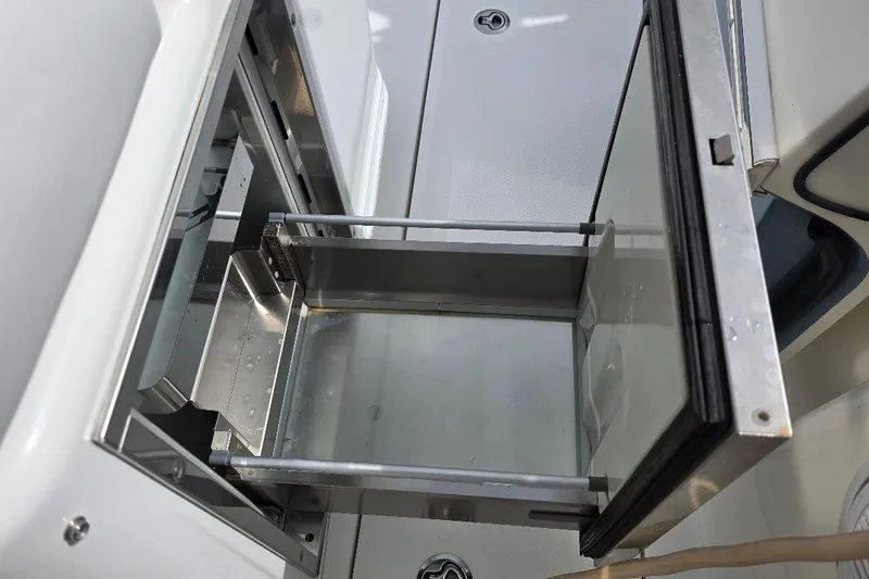  Yacht Photos Pics Open storage compartment on a 2016 Boston Whaler 370 Outrage boat.