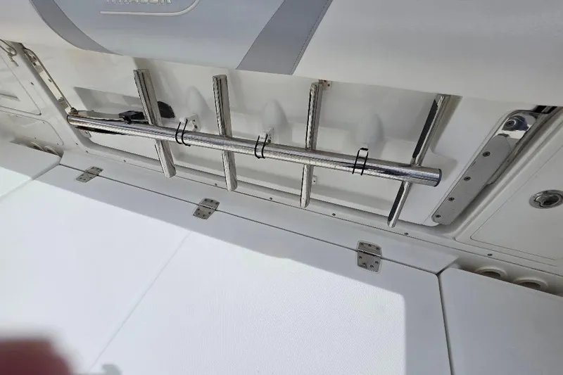  Yacht Photos Pics 2016 Boston Whaler 370 Outrage boat interior with rod holders and storage compartments.