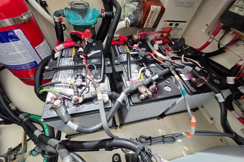  Yacht Photos Pics Battery compartment of a 2016 Boston Whaler 370 Outrage with wiring and fire extinguisher.