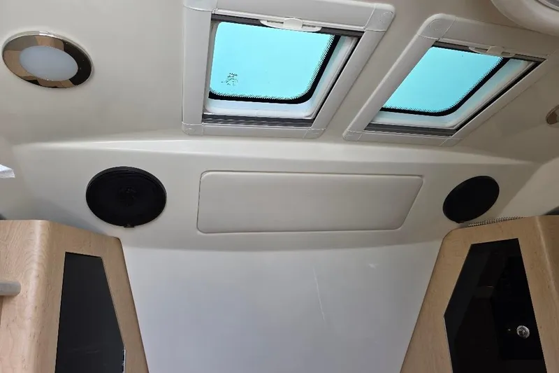  Yacht Photos Pics Interior ceiling of 2016 Boston Whaler 370 Outrage with skylights and speakers.