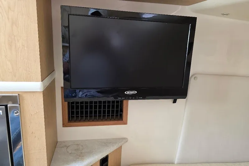  Yacht Photos Pics Interior of 2016 Boston Whaler 370 Outrage with mounted Jensen TV.