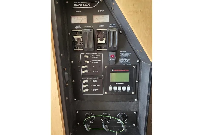  Yacht Photos Pics 2016 Boston Whaler 370 Outrage control panel with switches and generator display.
