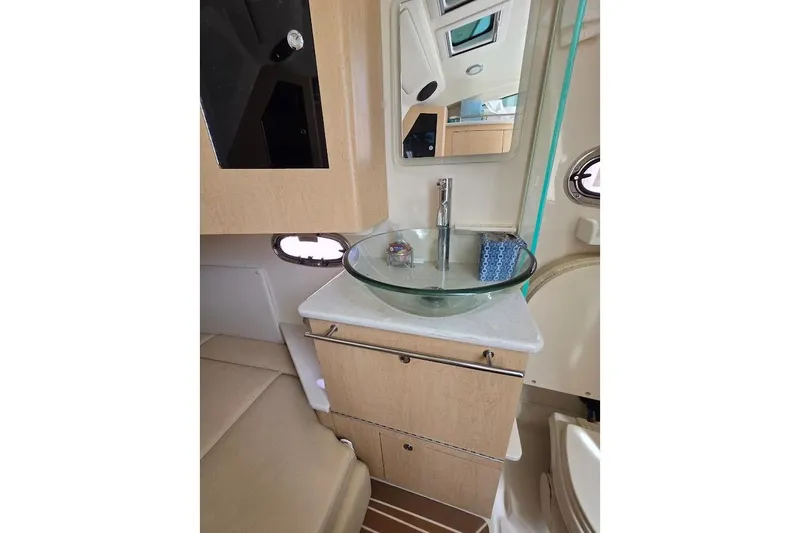  Yacht Photos Pics Interior of 2016 Boston Whaler 370 Outrage featuring modern sink and cabinetry.