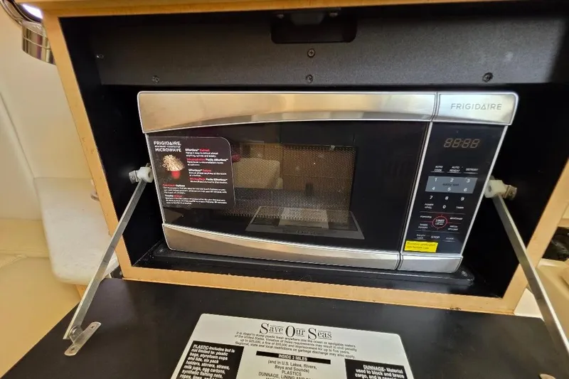  Yacht Photos Pics Frigidaire microwave inside 2016 Boston Whaler 370 Outrage boat kitchen area.