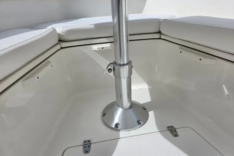  Yacht Photos Pics 2016 Boston Whaler 370 Outrage interior seating area with metal table mount.