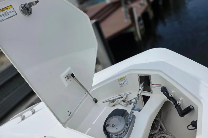  Yacht Photos Pics 2016 Boston Whaler 370 Outrage anchor locker with open hatch and visible ropes.