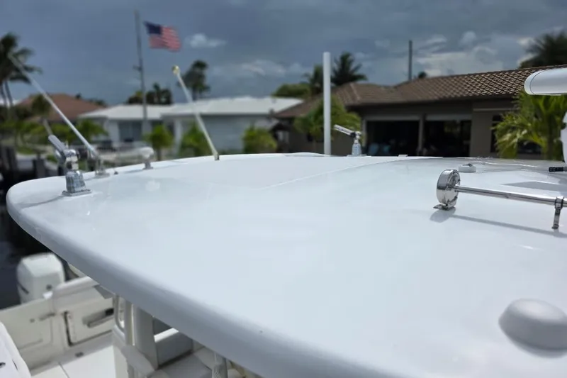  Yacht Photos Pics 2016 Boston Whaler 370 Outrage boat deck with American flag in background.