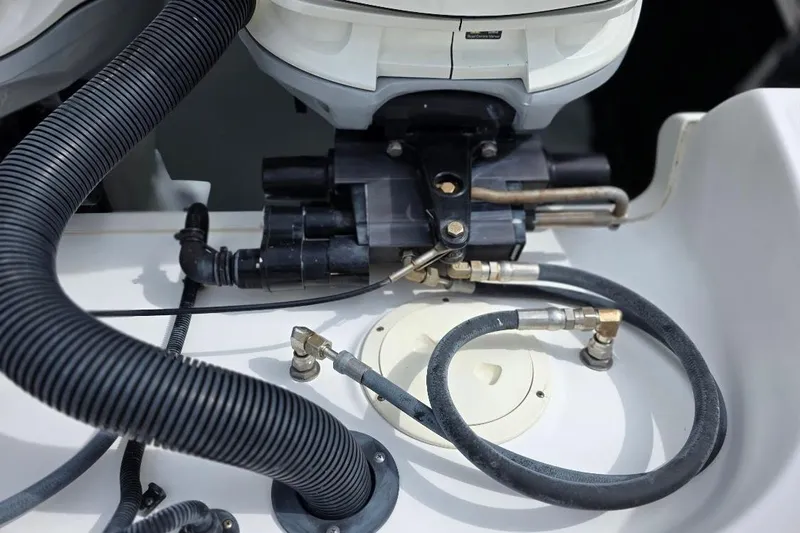  Yacht Photos Pics Engine components of a 2016 Boston Whaler 370 Outrage boat, featuring hoses and connectors.