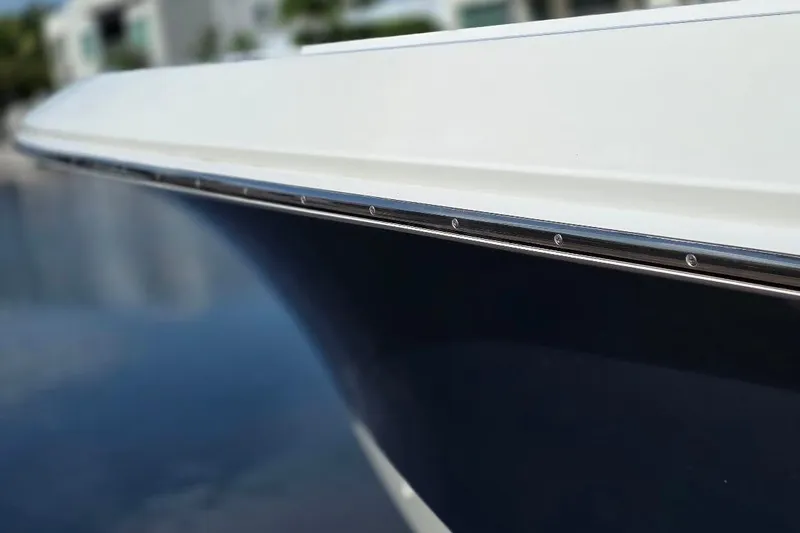  Yacht Photos Pics Close-up of 2016 Boston Whaler 370 Outrage boat hull, showcasing sleek design and craftsmanship.