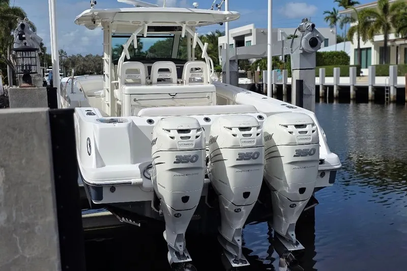  Yacht Photos Pics 2016 Boston Whaler 370 Outrage with triple 350 engines docked by waterfront.