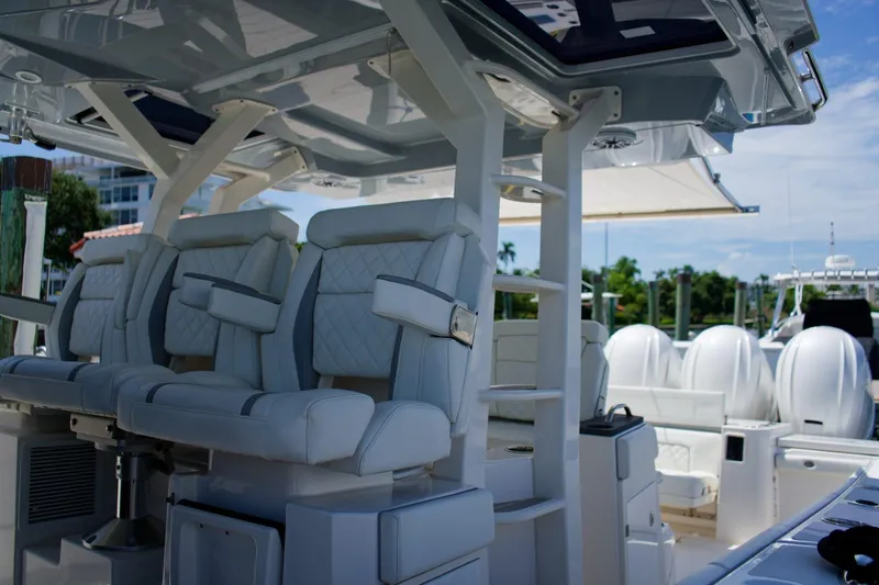 W7 Yacht Photos Pics 2022 Pursuit S 428 Sport boat interior with luxurious seating and modern design.