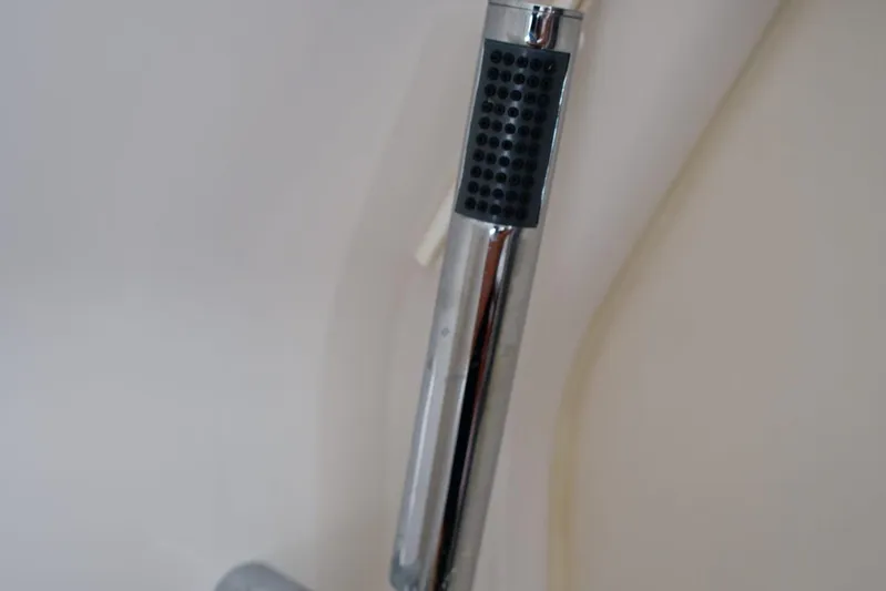 W7 Yacht Photos Pics Close-up of a chrome handle with textured grip on a 2022 Pursuit S 428 Sport.