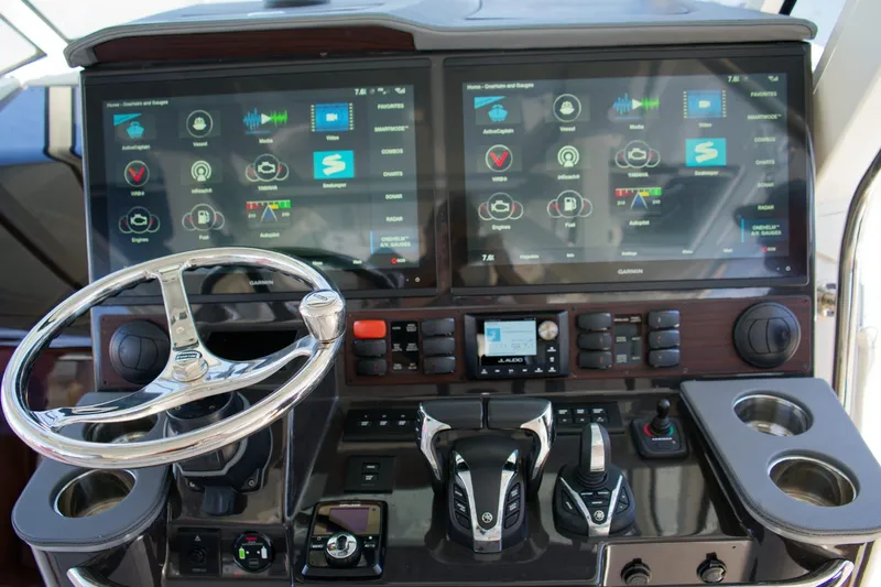 W7 Yacht Photos Pics 2022 Pursuit S 428 Sport boat dashboard with dual touchscreen displays and controls.